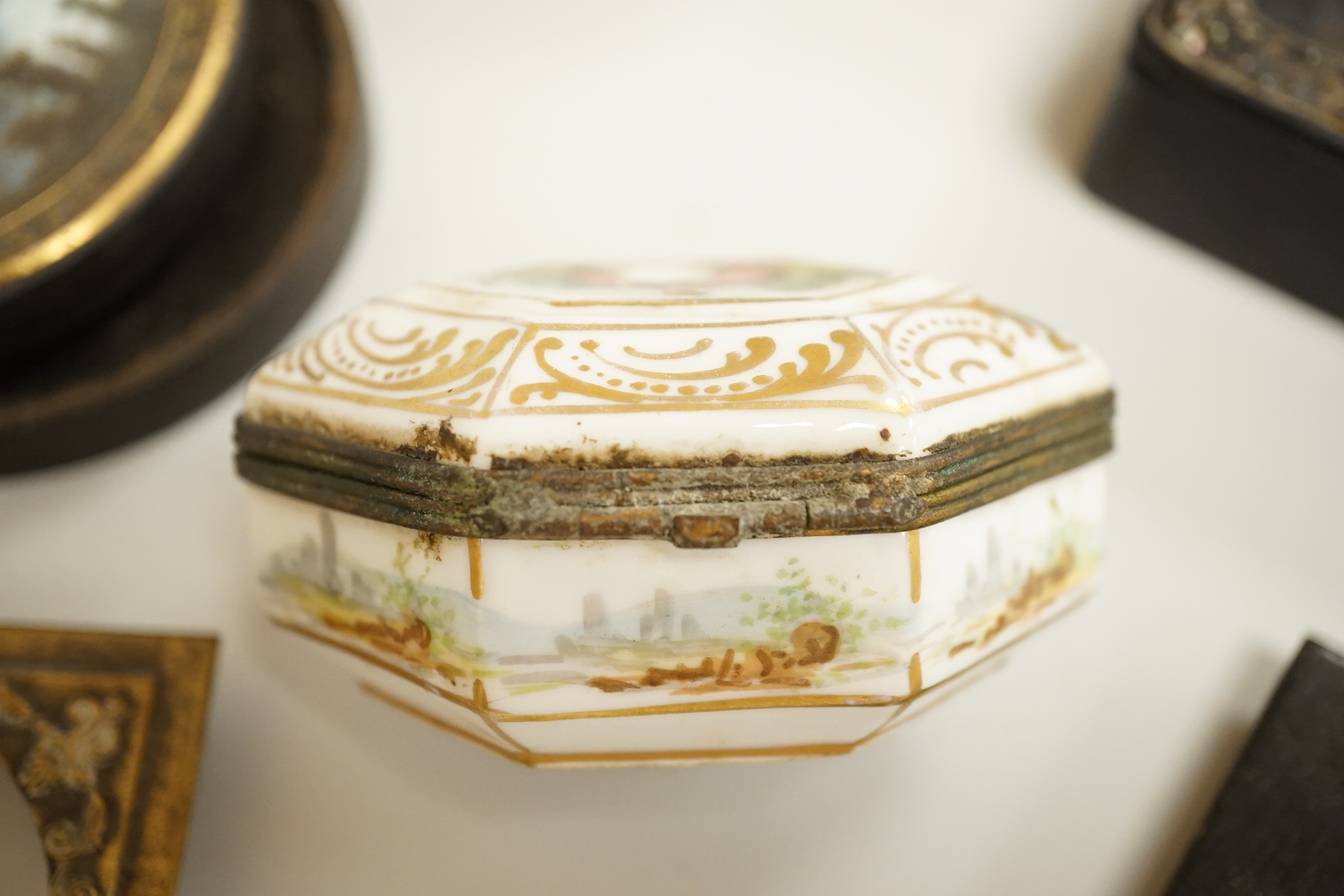 A collection of 19th century and later snuff and pill boxes, a silhouette frame and a gilt metal frame